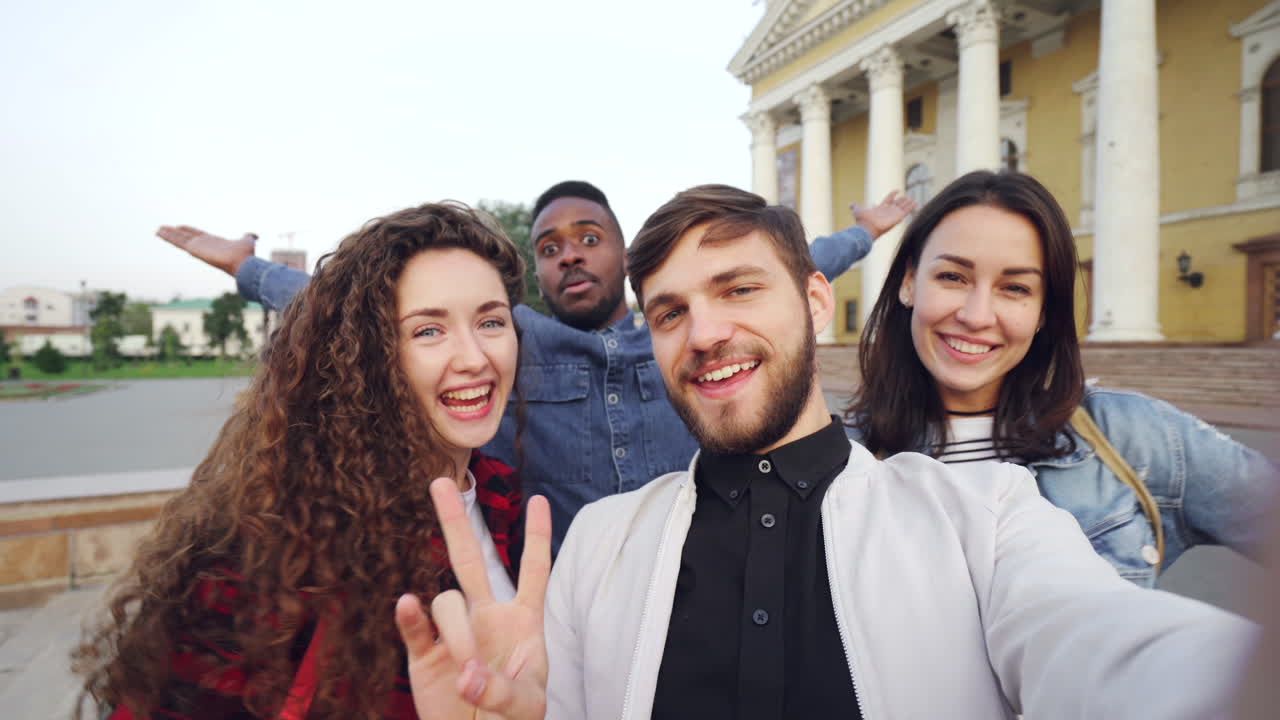 Friends Taking a Selfie in Front of a Building