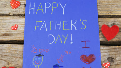 paintings and happy fathers day message on paper