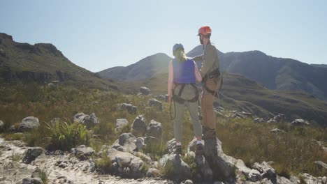 Young-Caucasian-couple-walking-in-zip-lining-equipment