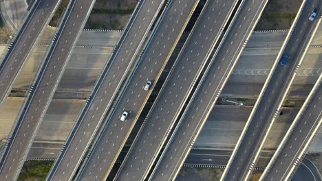 aerial top view of highway, transport city junction road with car on intersection cross road