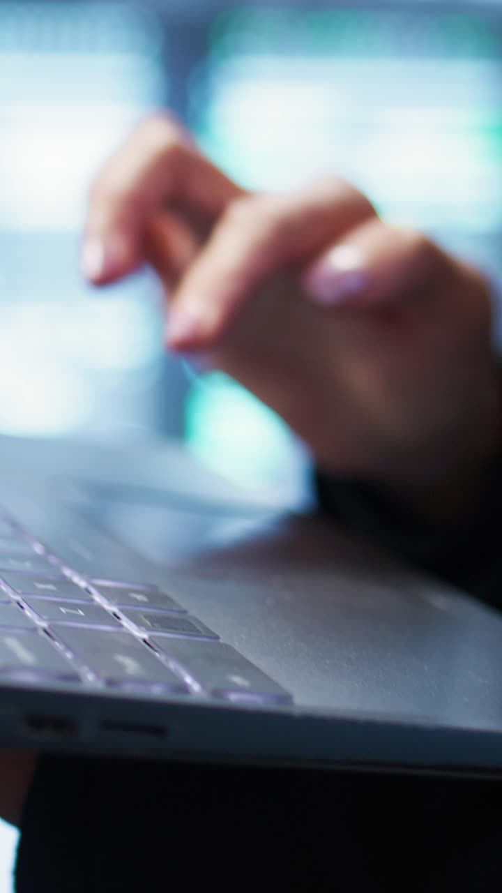 Close-up of Hand Typing and Using Trackpad on Laptop