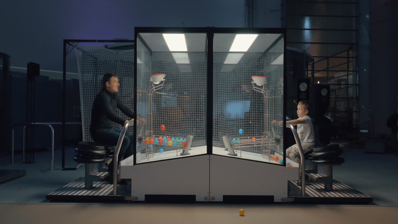 Dad and son playing funny ball game