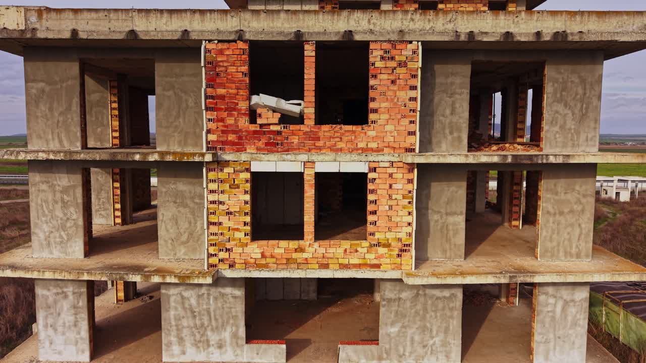 View of an abandoned building under construction in a rural area
