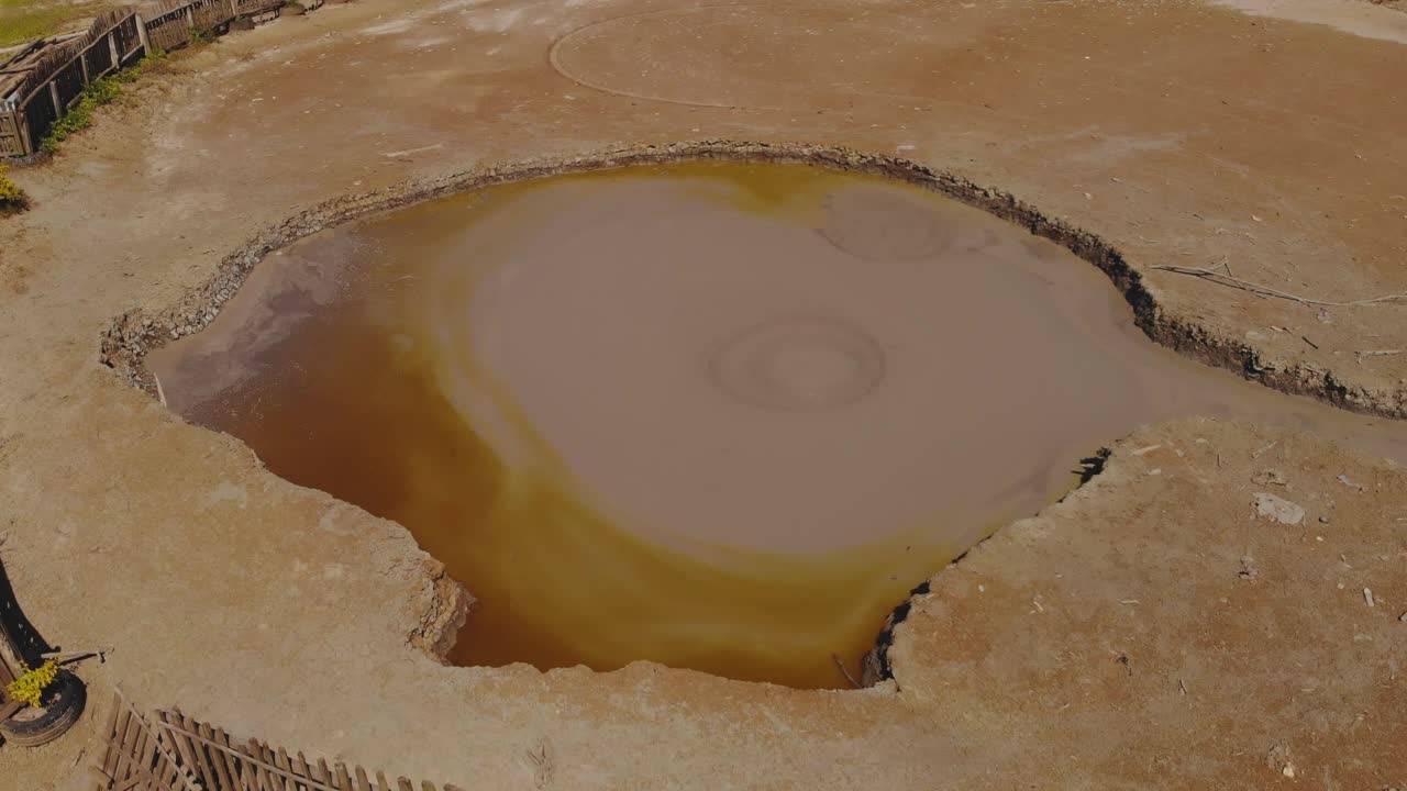 L'eau Michel mud volcano is a wet type volcano with mud rising in the form of bubbles and then flowing down the sides of the cone