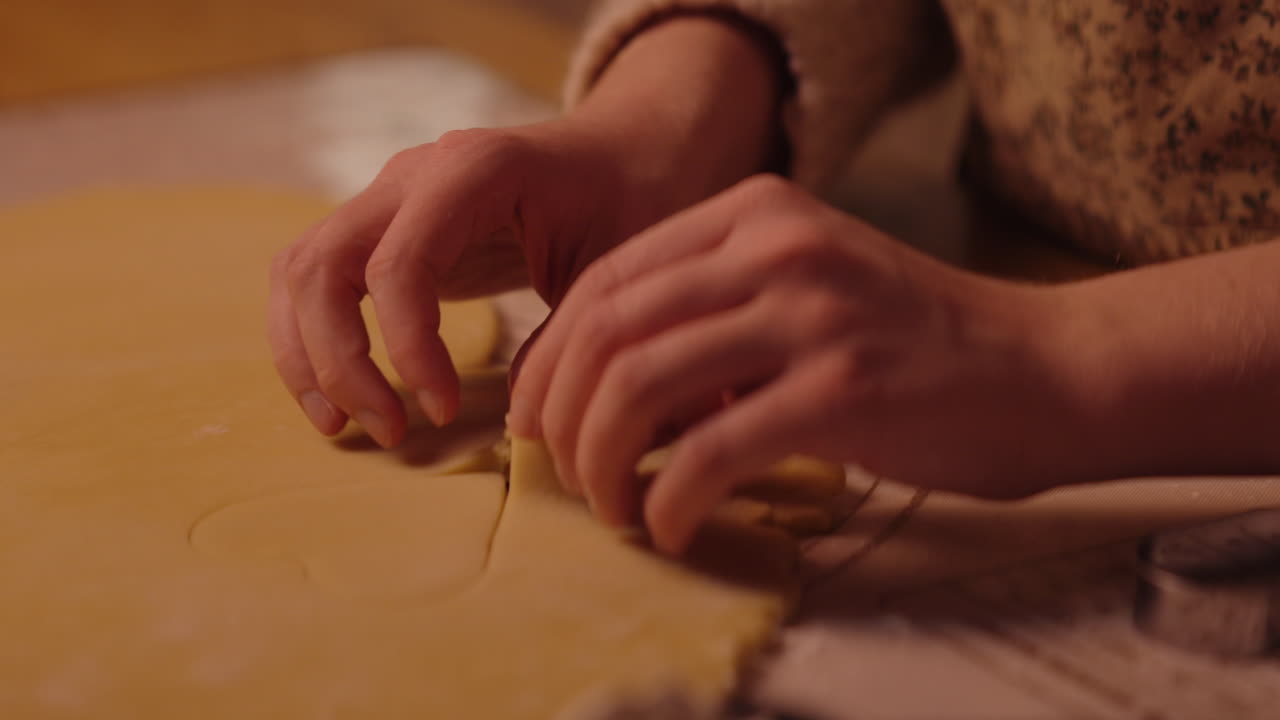 Woman Baking Heart Shaped Cookies