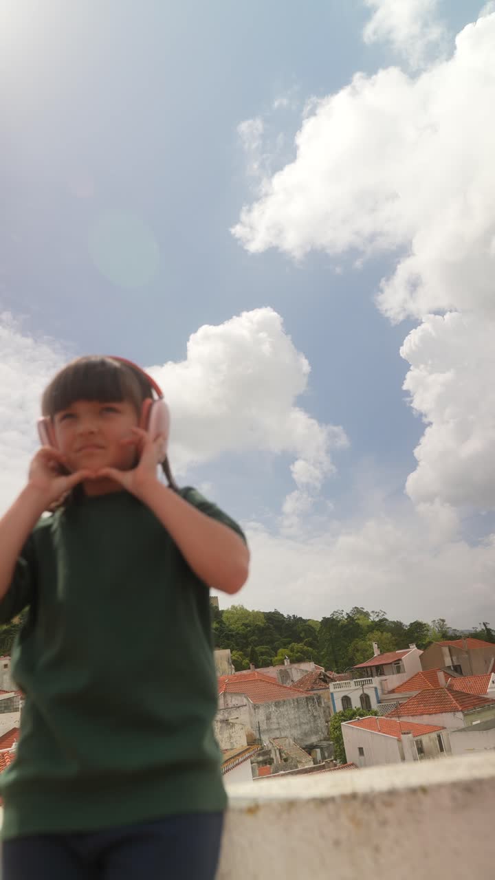 Girl listening to music on a rooftop