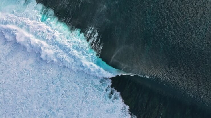 Aerial View of Powerful Ocean Waves Crashing on the Shore