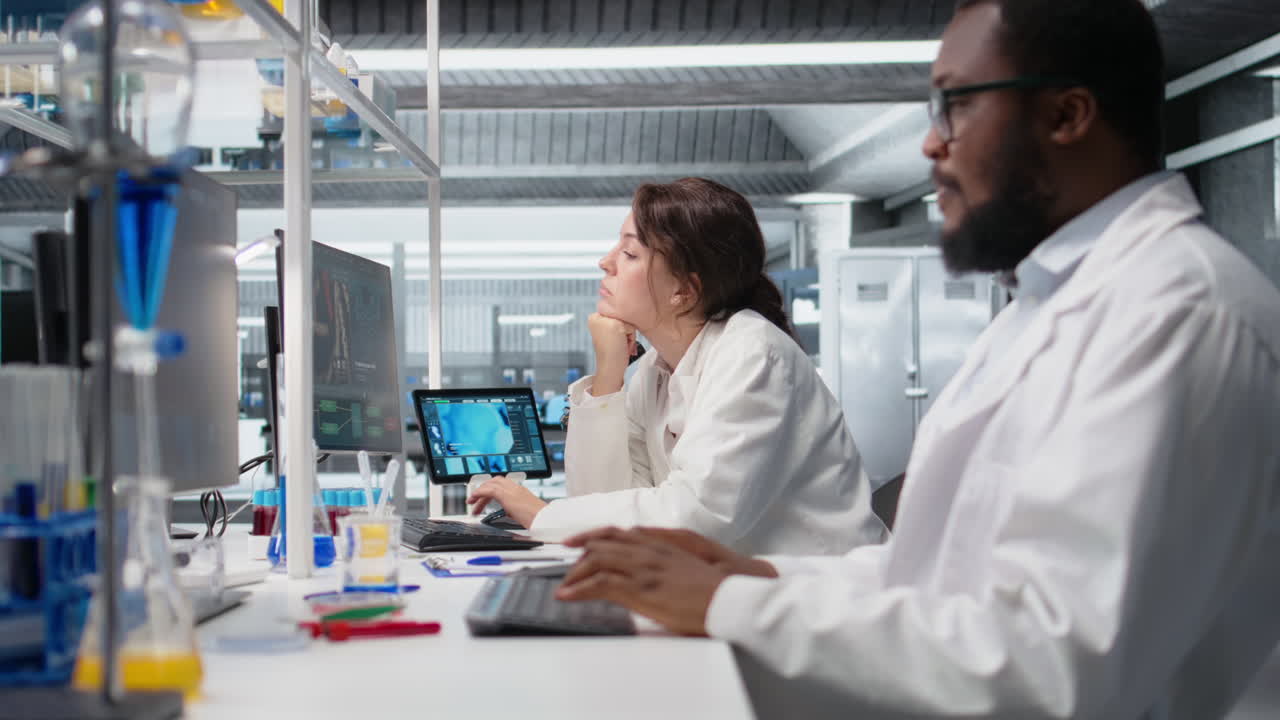 Vertical video Diagnostic laboratory manager overseeing scientists looking at molecular models