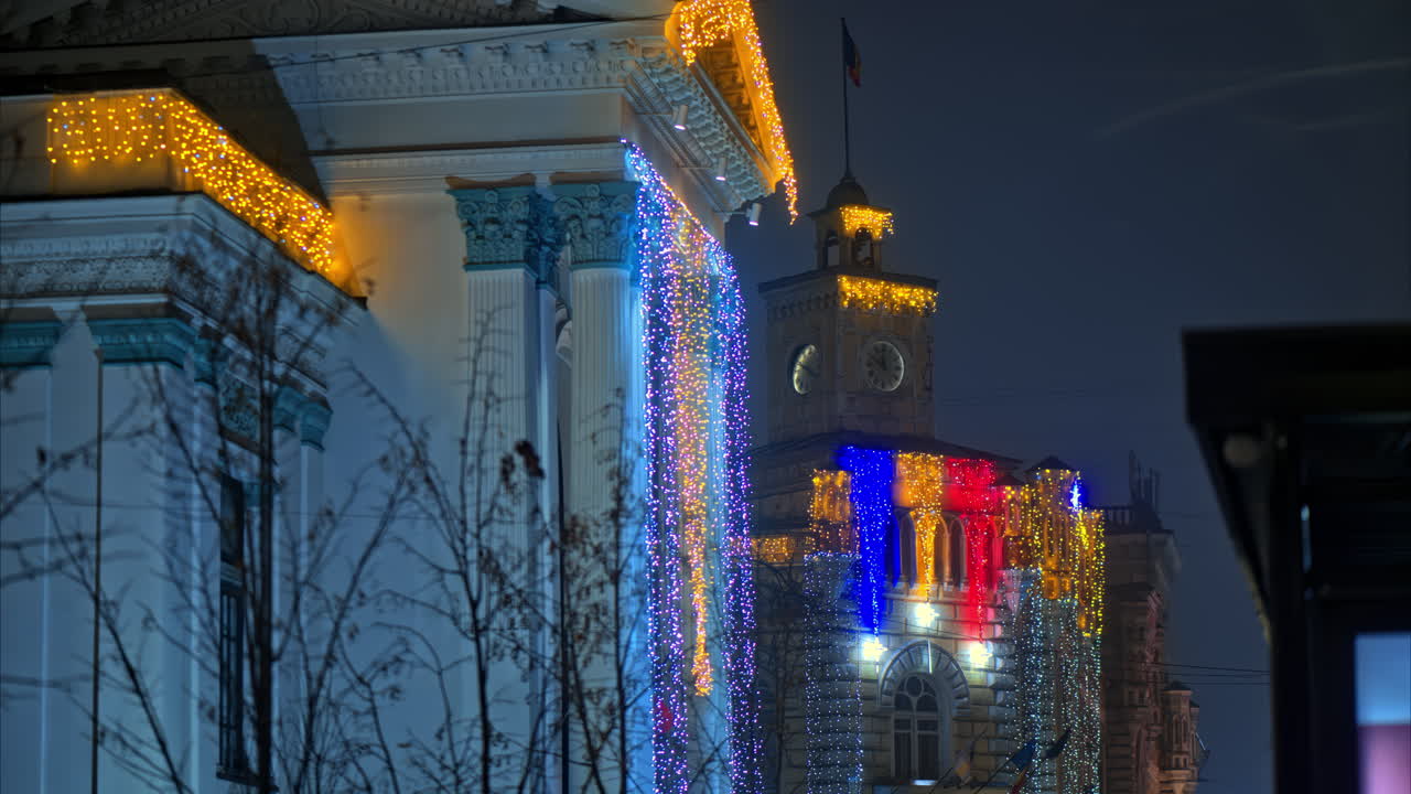 Colourful Christmas lights sparking on the Organ Hall and the City Hall on Stefan cel Mare boulevard in Chisinau, Moldova