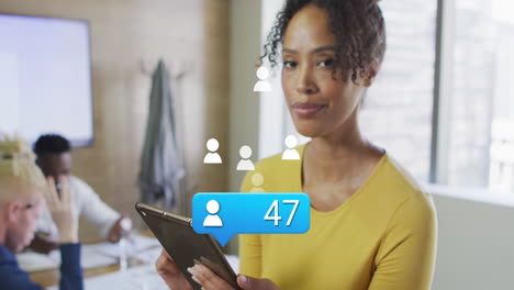 animation of icons and data processing over african american businesswoman in office