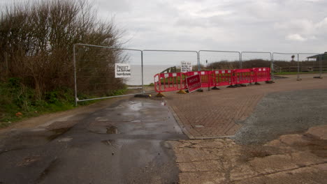 wide shot of beach rd showing its fallen over the cliff at happisburgh in march 2024