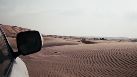 Adventure-through-vast-desert-landscapes-with-a-car-driving-seamlessly