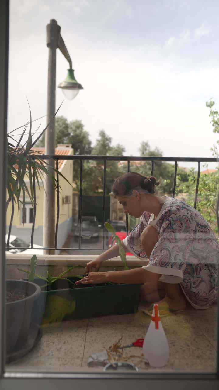 Woman Gardening on Balcony