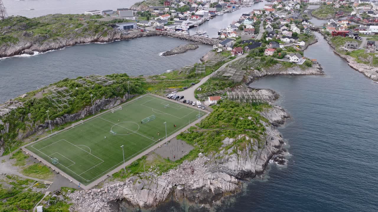 Drone shot of soccer field on island in Lofoten in Norway during summer 4k