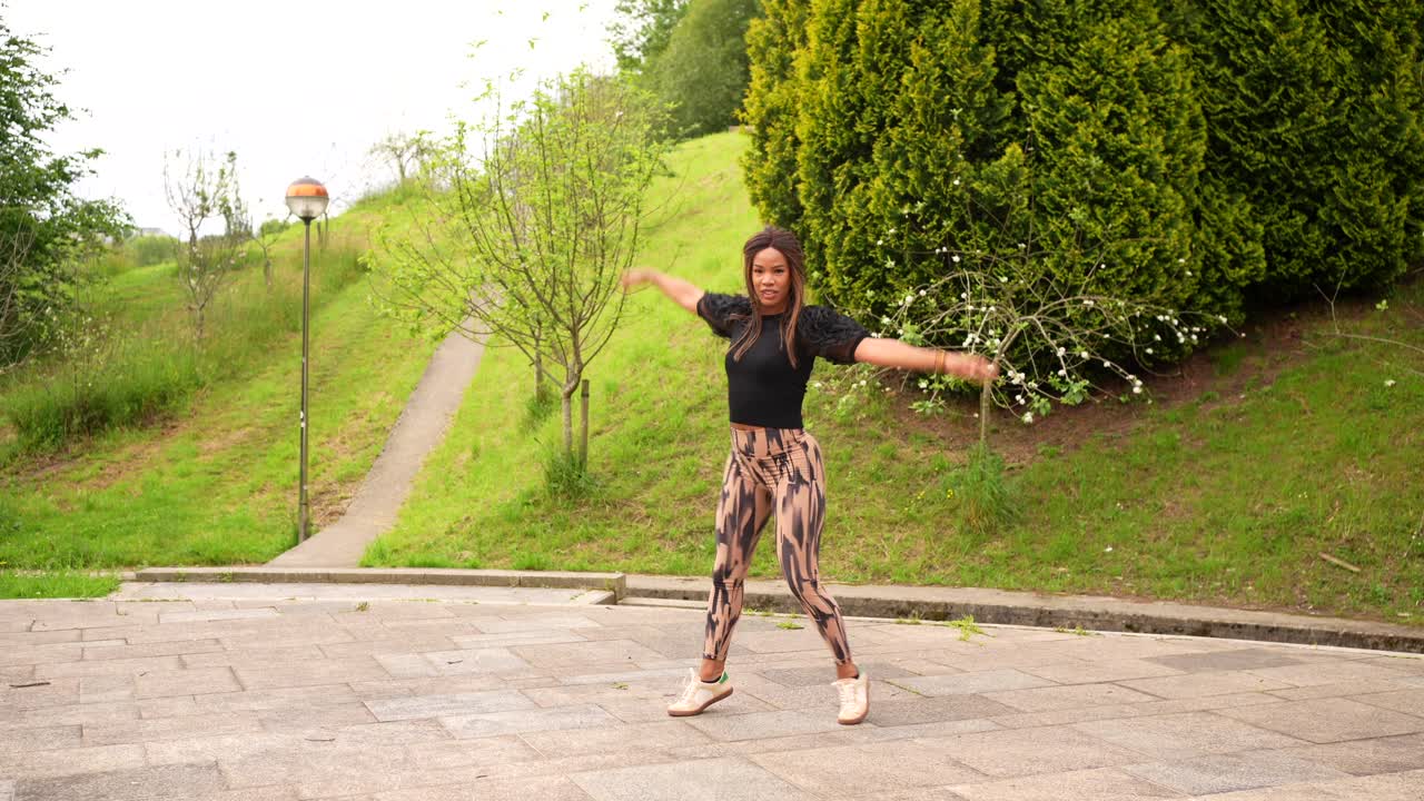 Woman Dancing in a Park