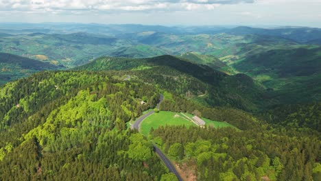 aerial shot revealing the monts d'ardeche regional parc on a sunny summer day, auvergne rhone alpes region, france