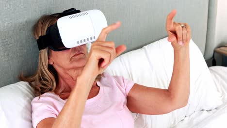 Senior-woman-using-virtual-reality-headset