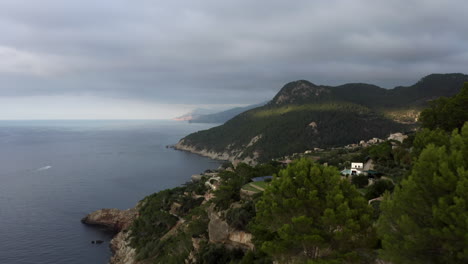 Aerial-flyover-of-Banyalbufar-village-on-the-western-coast-of-Mallorca,-Spain