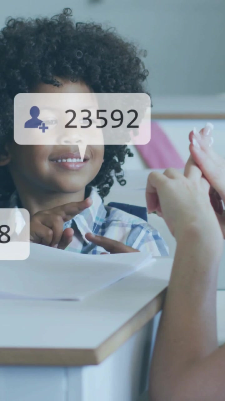 Vertical video: Adult raising thumb-up cueing child mirroring gestures for education, icons popping