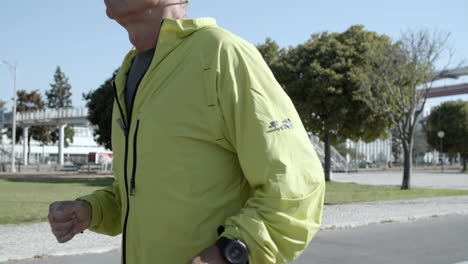 senior jogger wearing smartwatch