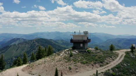 aerial passing manned fire lookout station in national forest