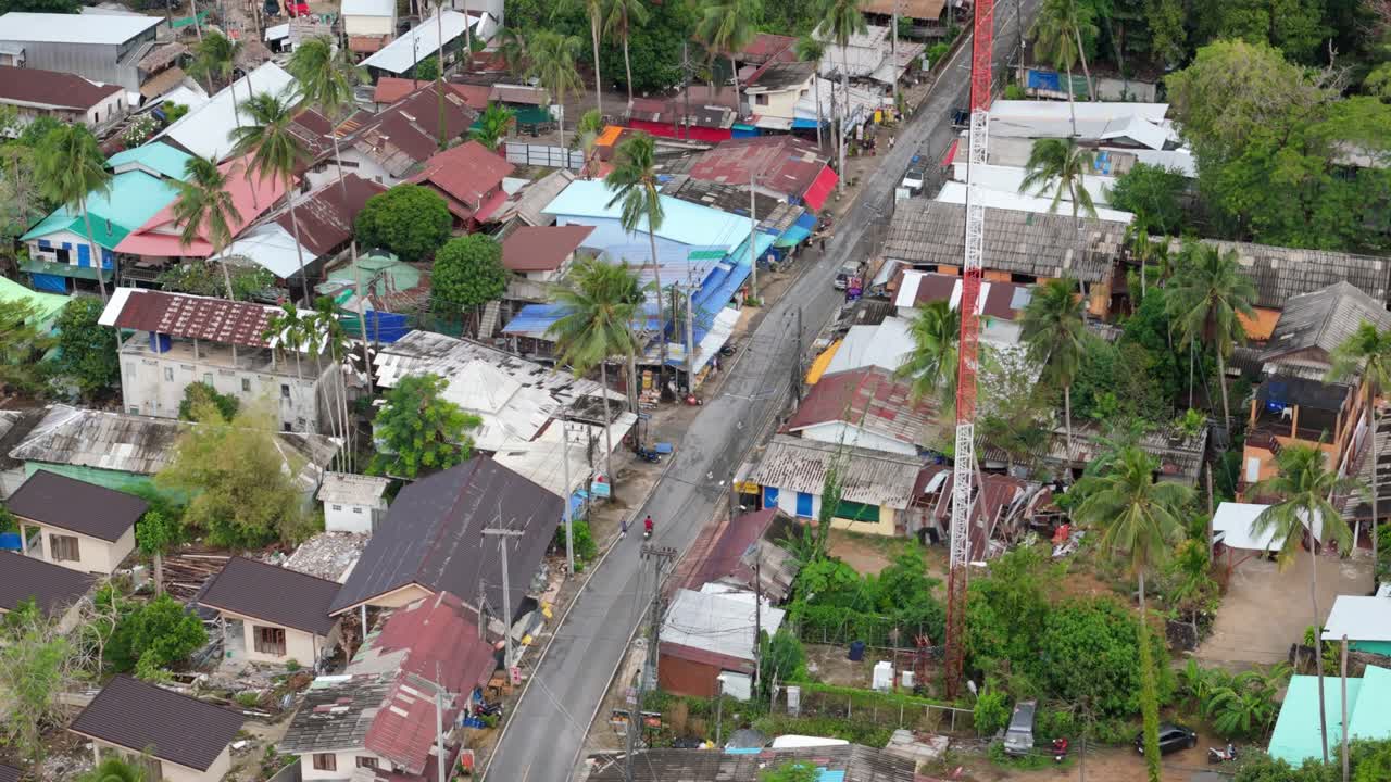 A birds-eye view of Lonely Beach on Koh Chang, Thailand showing the village, shops, main road and guest house accommodation