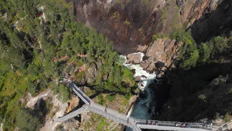 Drone-flight-over-new-bridge-at-Voringsfossen-Falls,-Eidfjord,-Norway