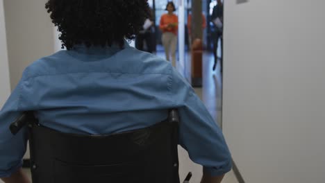 happy disabled and diverse business people walking and talking at office