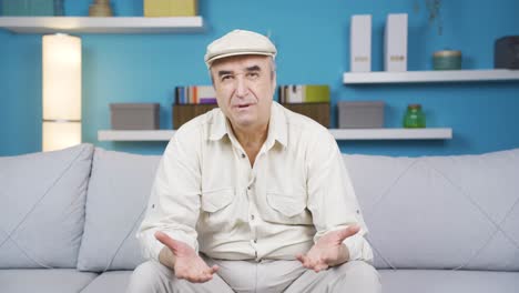 Cheerful-and-happy-old-man-smiling-and-winking-at-camera.