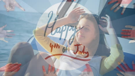 animation of happy 4th of july text over smiling woman sailing in yacht