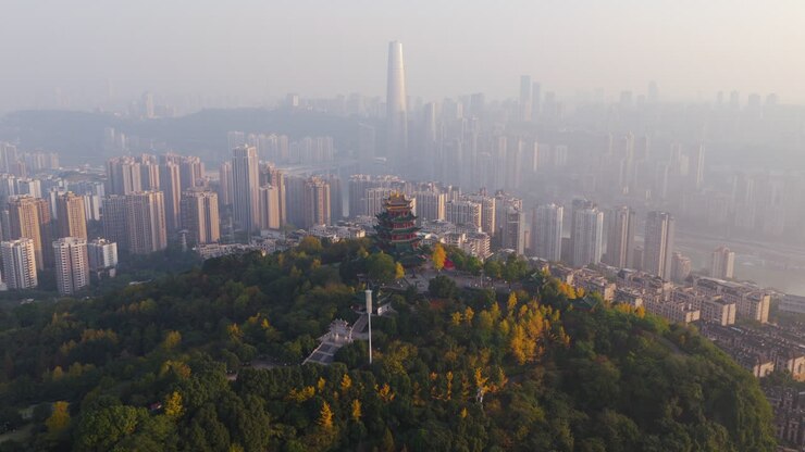 Hong'en Pavilion Atop Longji Hill In The Jiangbei District With Downtown Chongqing Skyline In China. - aerial shot