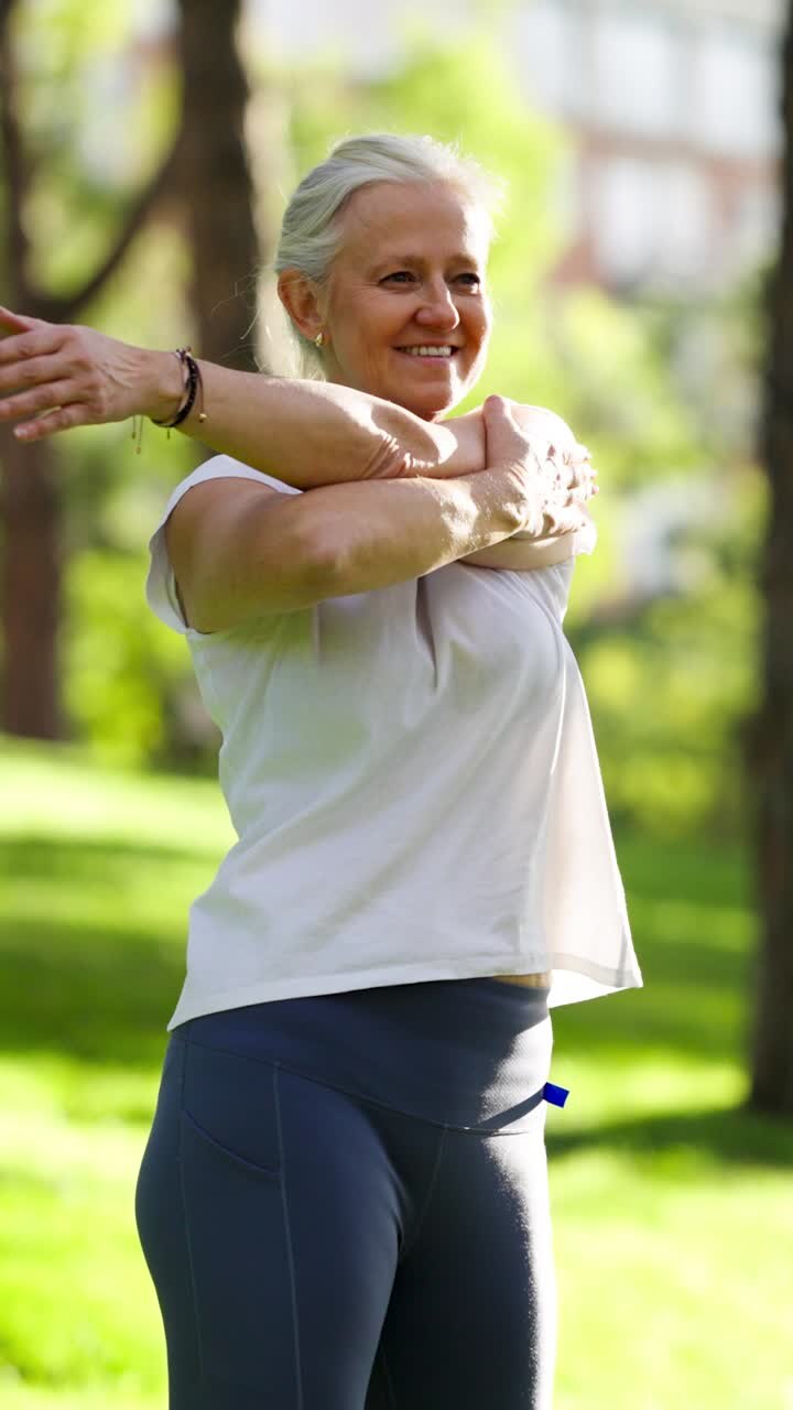 Mature woman stretching in the park