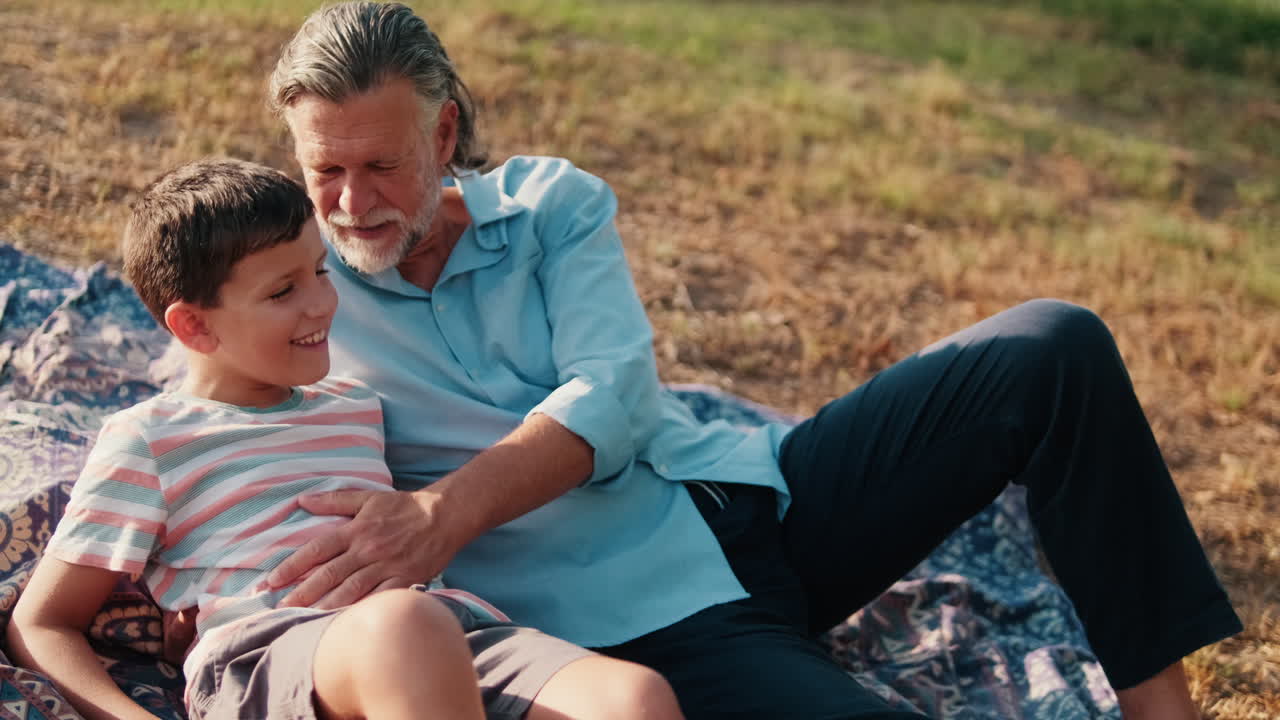 Grandfather and Grandson Bonding Outdoors