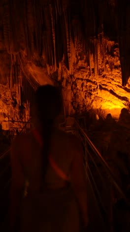 cave interior with warm lighting and people