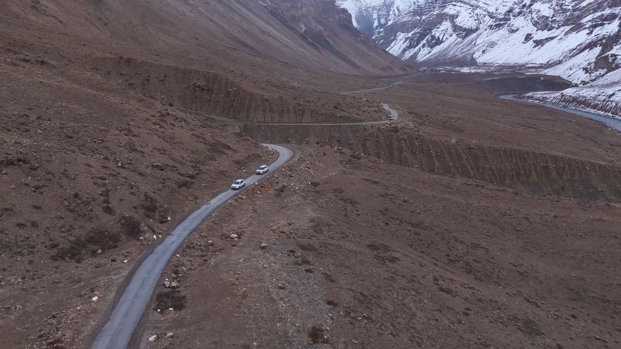 High-Altitude Mountain Road with Cars
