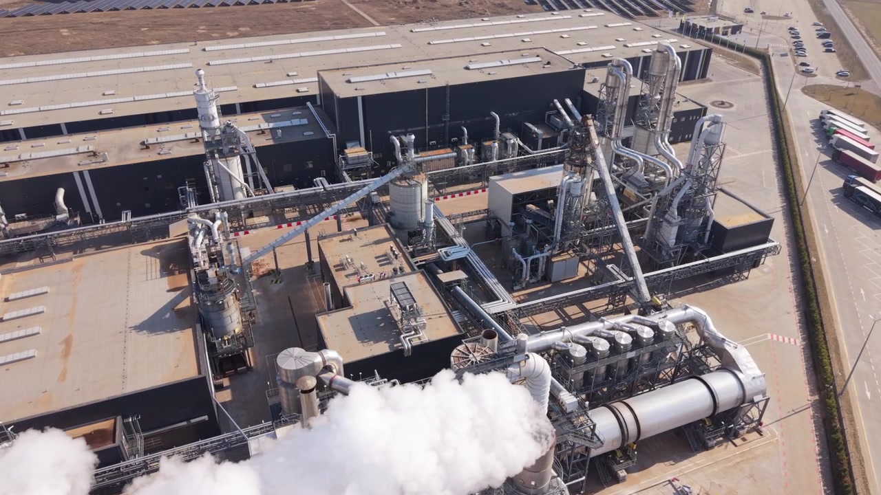 Aerial Industrial Plant With Dense Pipework And White Steam, Close Up Of Turbines, Ducts And Service Platforms, Maintenance Accessways And Ventilation Stacks, Crisp Daylight Surveillance