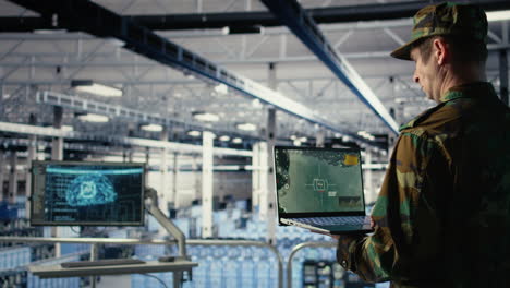military data center specialist using radar software on laptop
