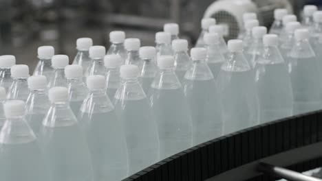 conveyor belt with bottles of drinking water at a modern beverage plant