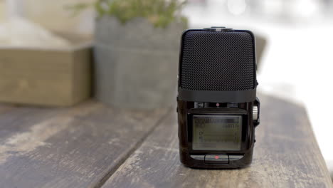 Working-dictaphone-on-cafe-table