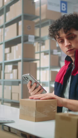 warehouse worker checking inventory and packaging