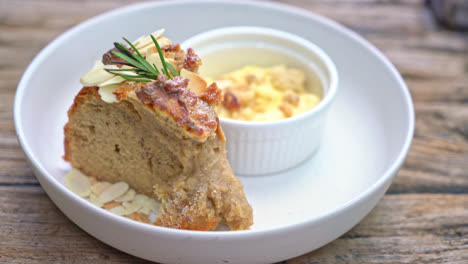 banana cake with cream cheese and crumble on plate