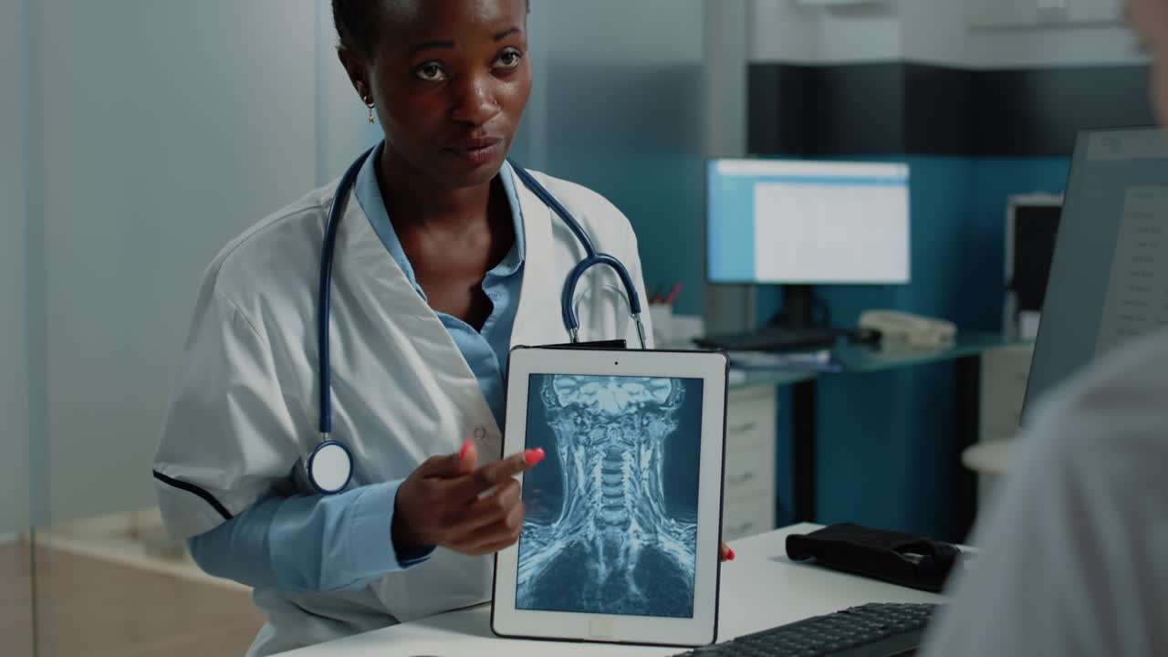 Doctor showing x-ray results to patient