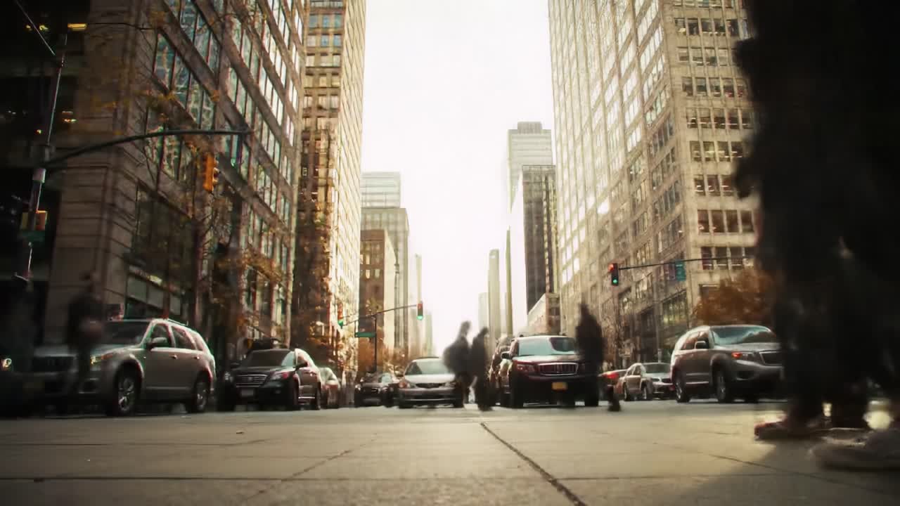 Urban Landscape: A Vibrant City Intersection Capturing the Flow of Pedestrians and Vehicles in a Busy Downtown Setting Surrounded by Towering Buildings
