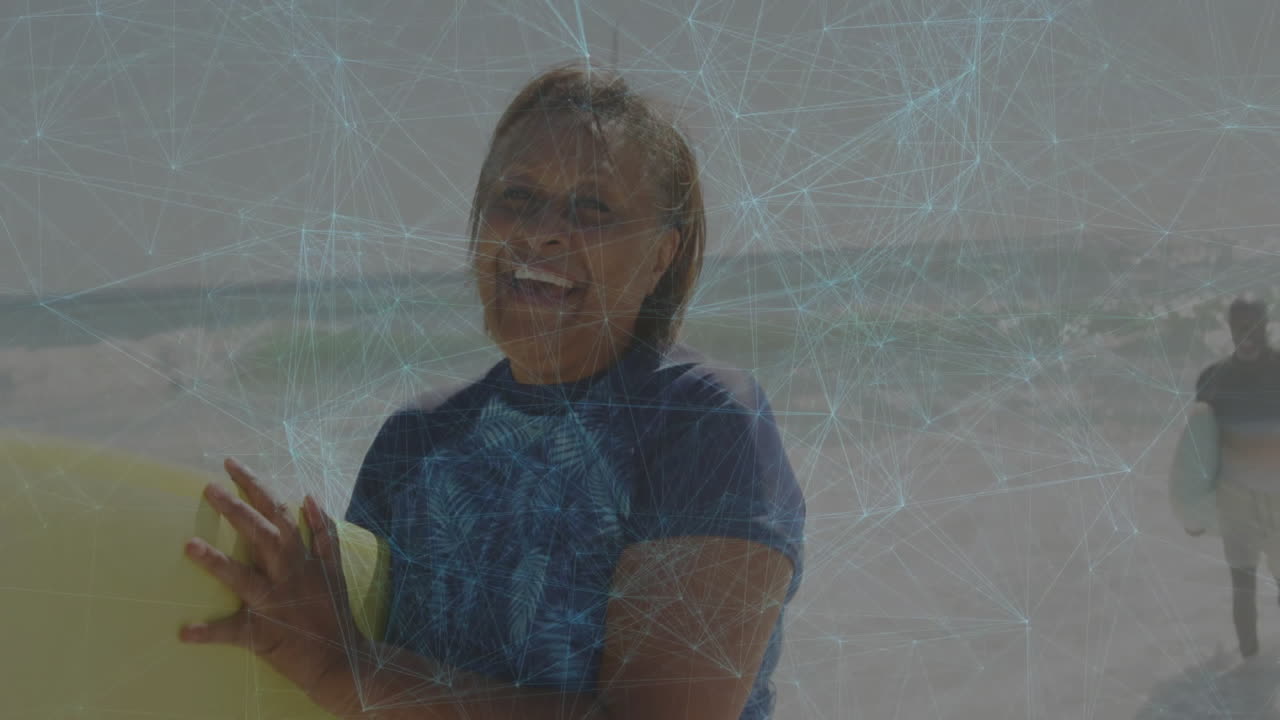 Adult male surfer smiling, gripping surfboard, walking on beach with floating health icon overlay