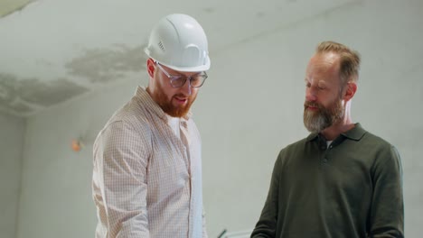 construction professionals reviewing plans