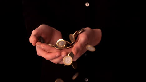 woman catching falling euro coins