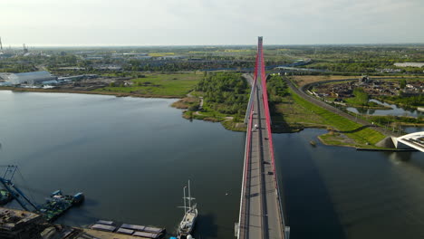 traffic at third millennium john paul ii bridge over calm water of martwa wisla river in gdansk, poland