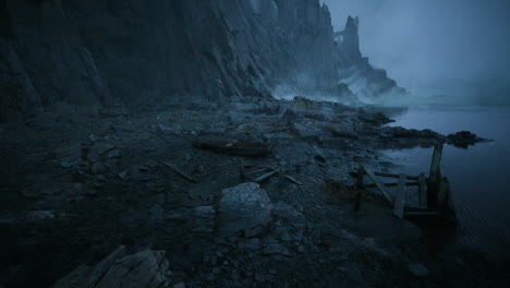 foggy dawn shoreline with rocky cliffs creates an eerie vibe
