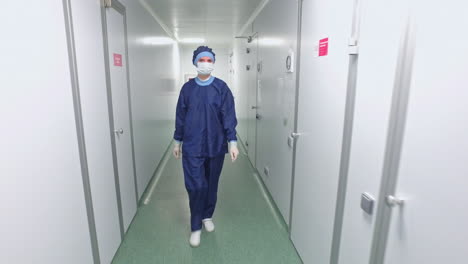 lab worker go in sterile corridor. scientist in laboratory corridor