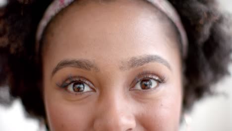 Portrait-of-happy-eyes-of-african-american-woman-at-home,-slow-motion